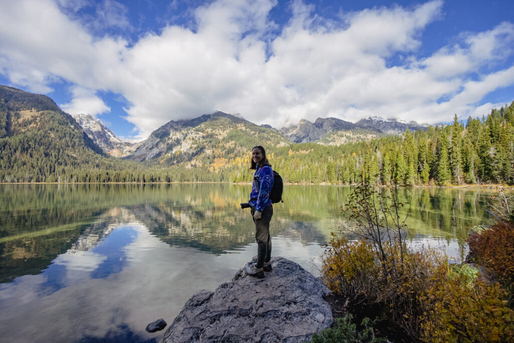 Woman standing by Taggart Lake, Grand Teton National Park