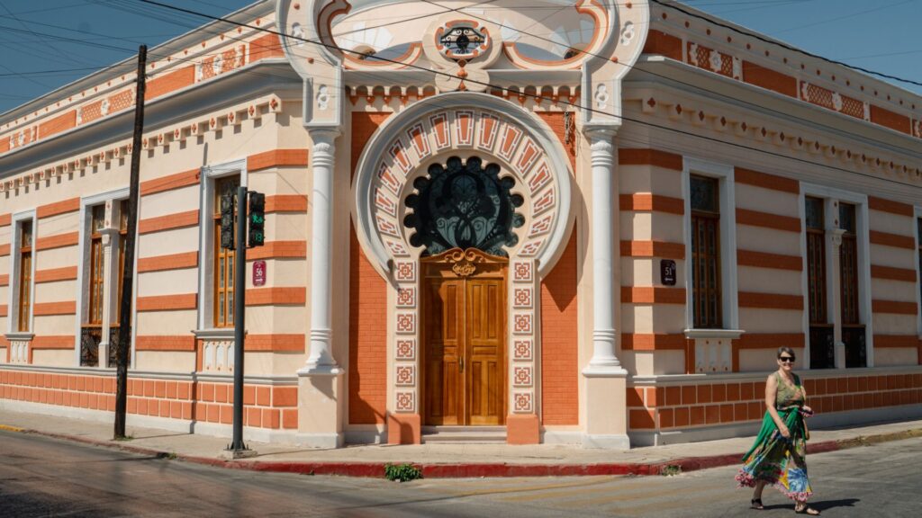 Woman walking down street in Merida, Mexico