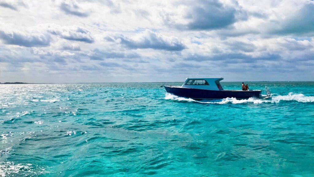 Boat sailing in blue ocean in Mexico