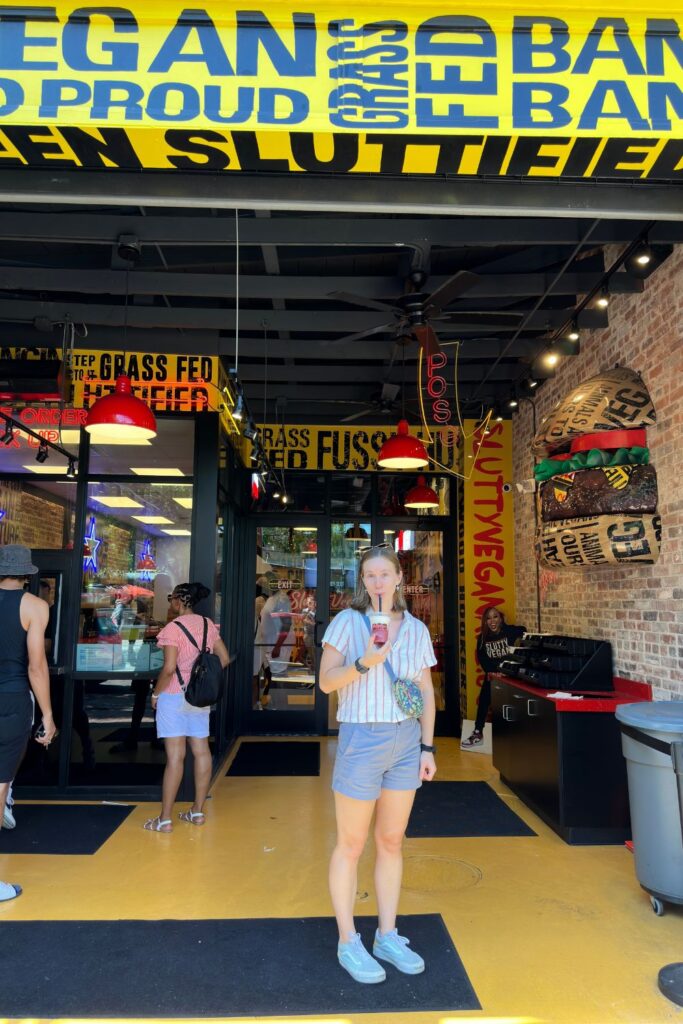 Woman drinking slushy from vegan restaurant in Deep Ellum Dallas