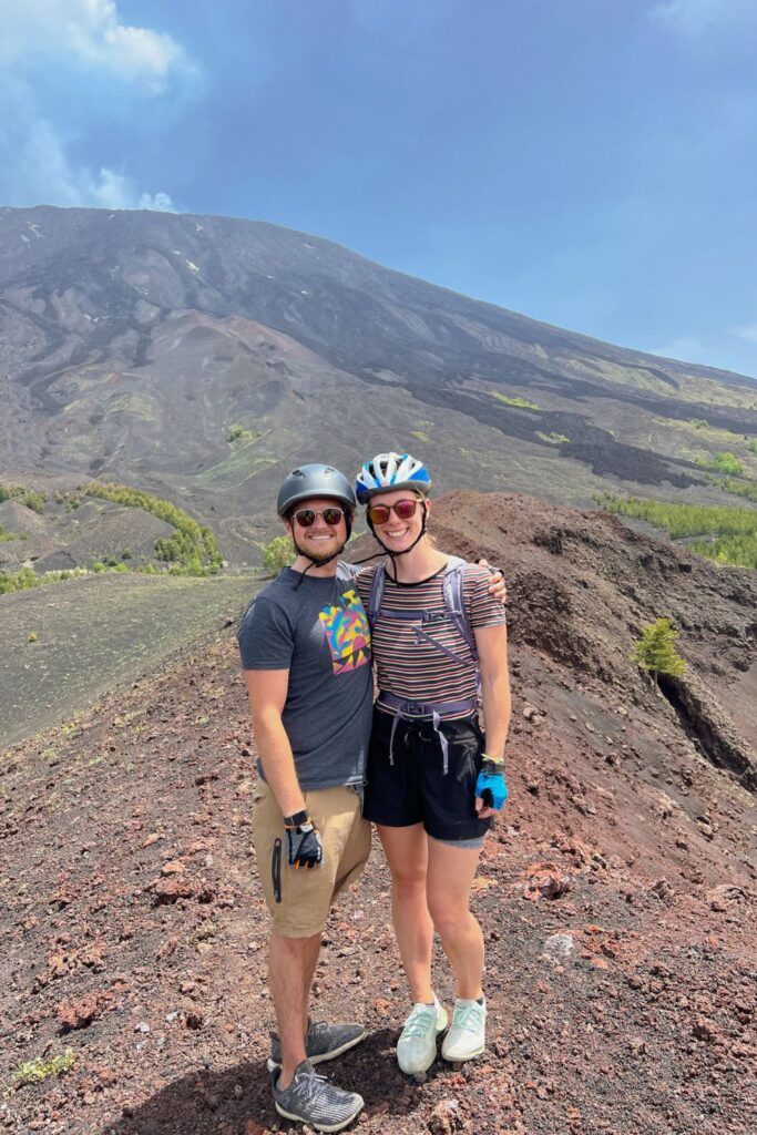 Couple standing on Mt Etna, Sicily, Italy