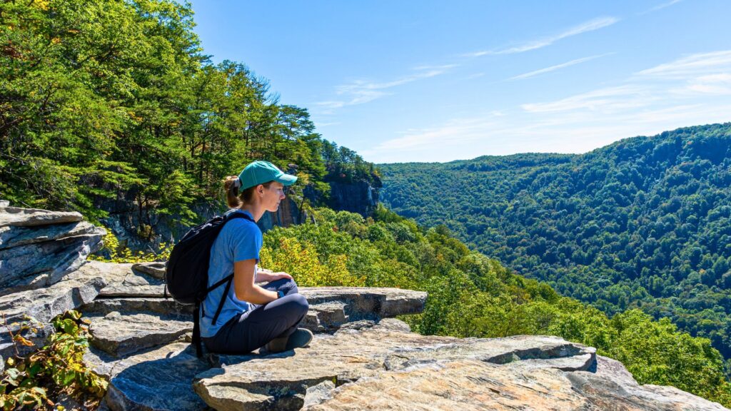 Sitting on a cliff overlooking New River Gorge