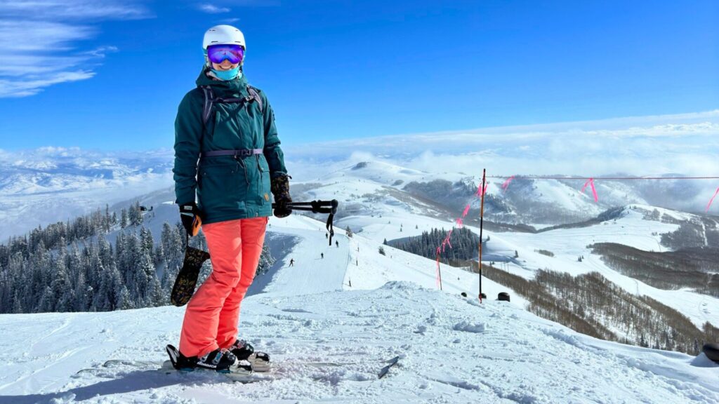 woman on top of ski slope in Park City Utah