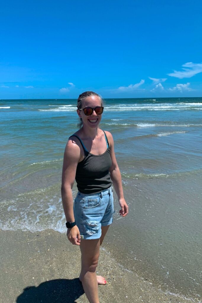 Standing in the waves on the beach