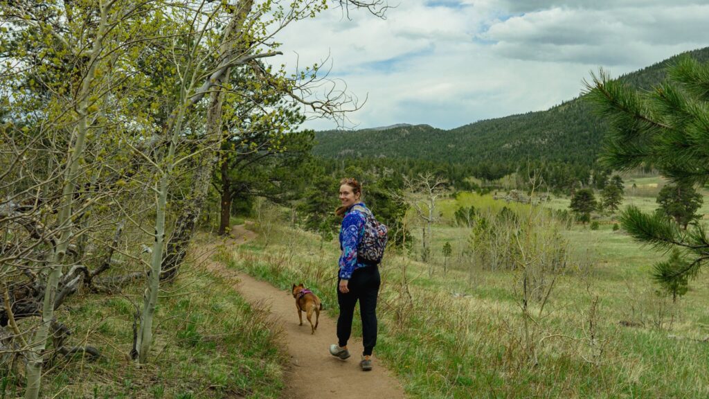 Woman and dog hiking in Estes Park