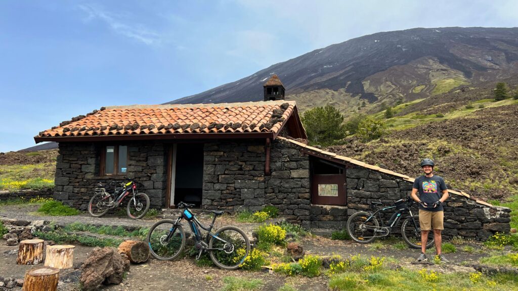 mountain biker stopping at rest hut on Mount Etna Sicily