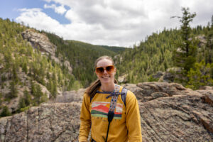 Woman smiling on hiking trail Roosevelt National Forest