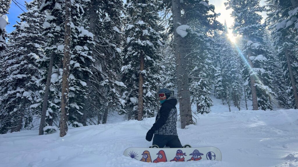 Snowboarder in the trees Park City