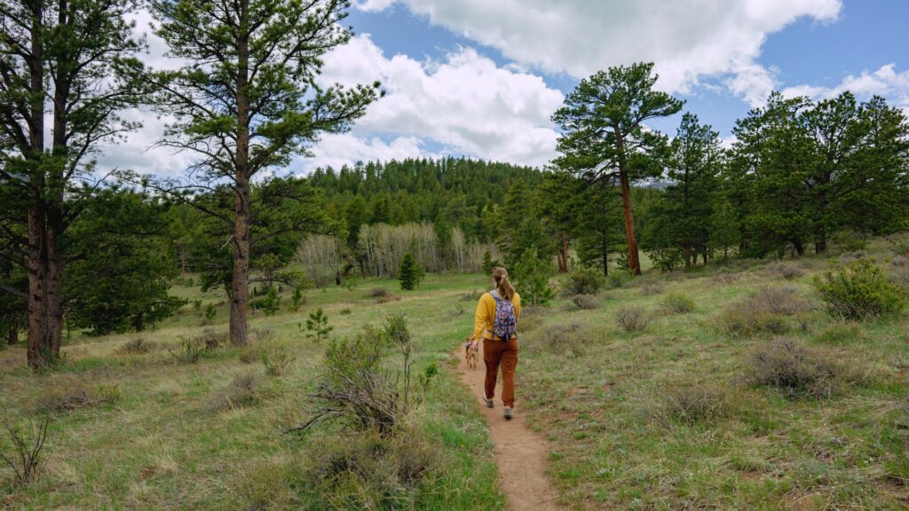 Woman and dog hiking in Allenstown Colorado