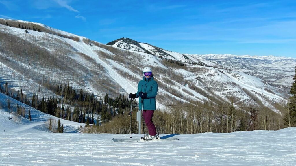 Women standing at top of run on skis