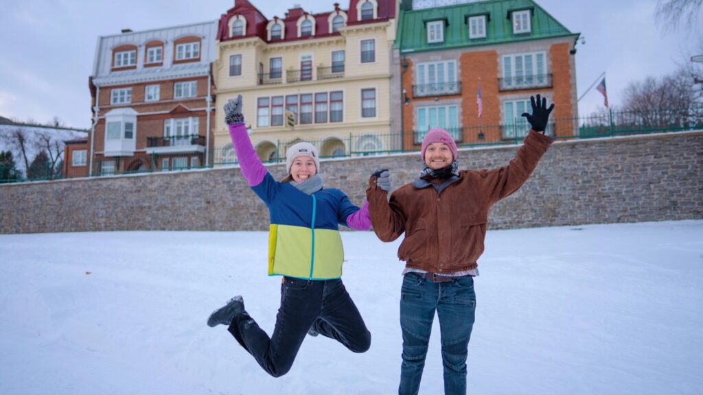 Couples Jumping in the Snow in a City