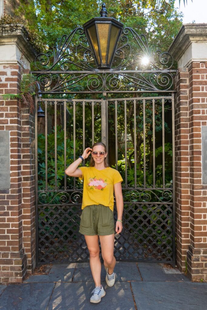 Woman by iron gate in Charleston