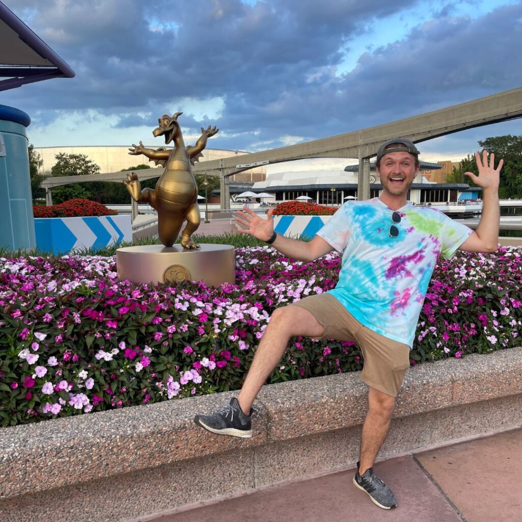 Nate with Floral Display in Epcot