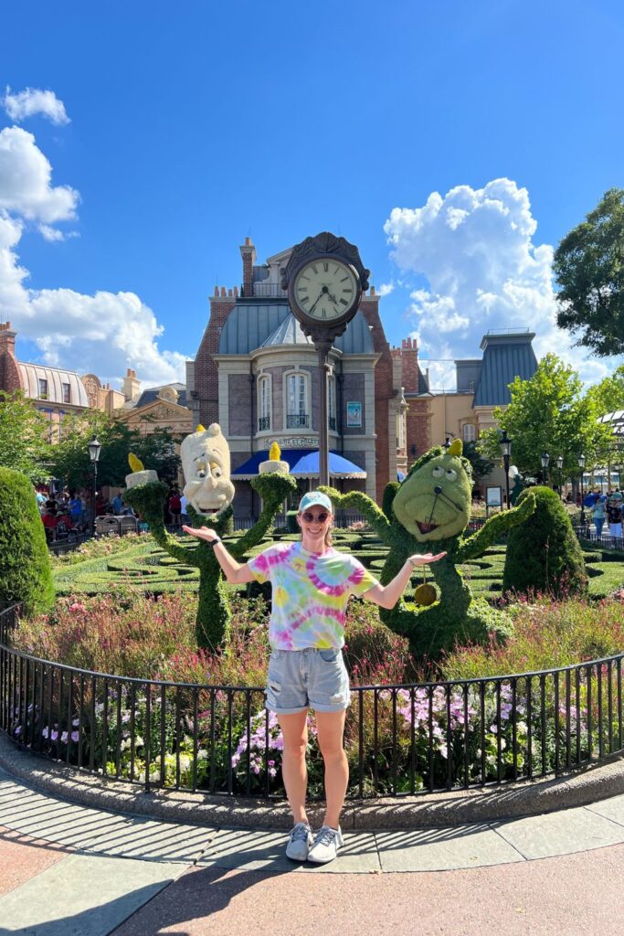 Posing with Floral Decor in Epcot (me)