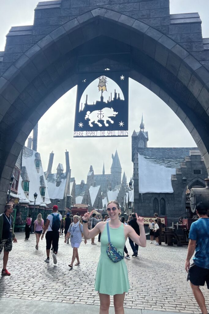 Woman in front of Hogsmeade Entrance (universal studios hollywood)