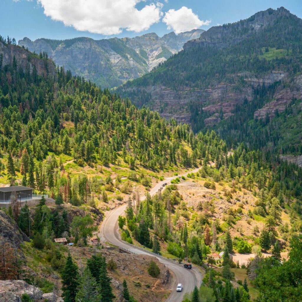 Car driving down mountain road in Ouray Colorado