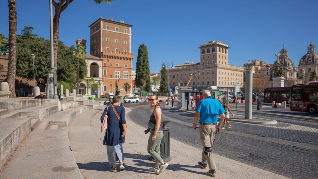 Family walking down street in downtown Rome Italy