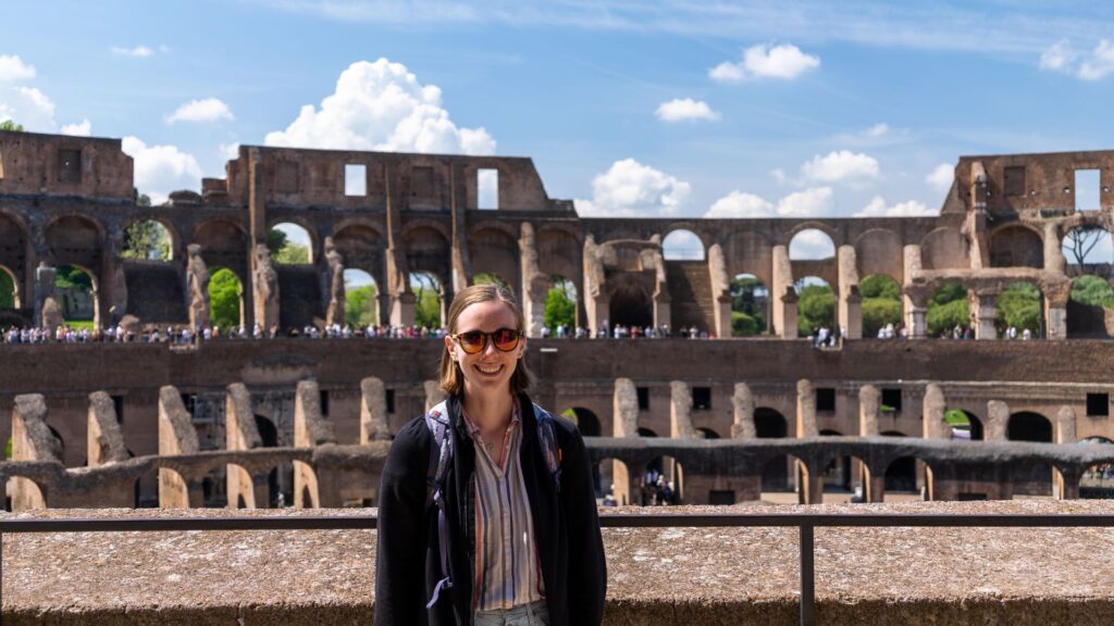 Woman posing in the Colosseum in Rome Italy