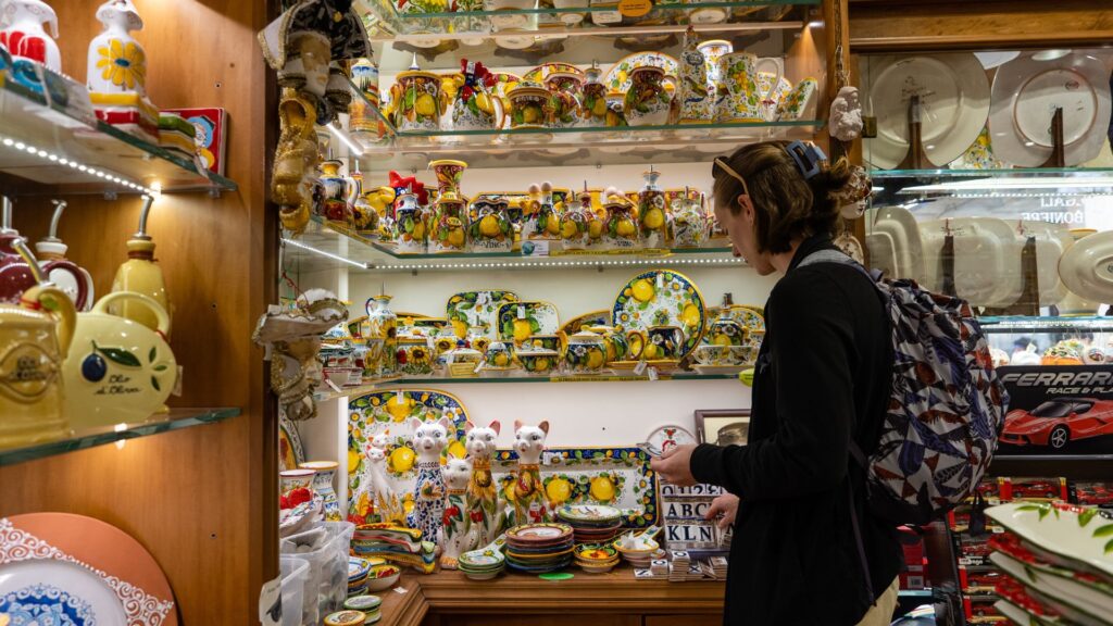 Woman shopping for souvenirs in Rome Italy