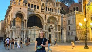 Woman standing in Venice Italy in the evening