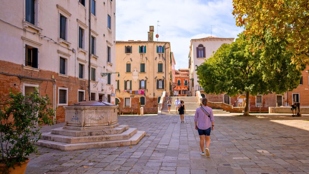 Woman walking in Venice Italy in the fall